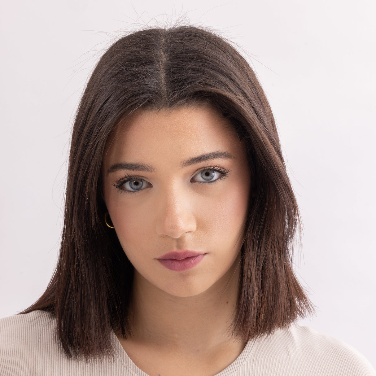 Model wearing Stained lip stain romance shade on a clean studio background.