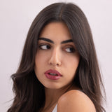 Model wearing Stained lip stain romance shade on a clean studio background.