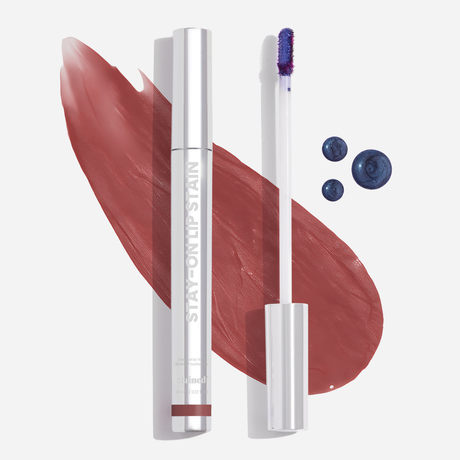 Stained Stay-On Lip Stain with applicator and whimsical color swipe on white background